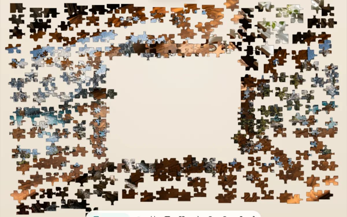 The Quiet Puzzle Table puzzle on Jigsaway, a still-life of a half-finished puzzle broken into pieces spread around the board.
