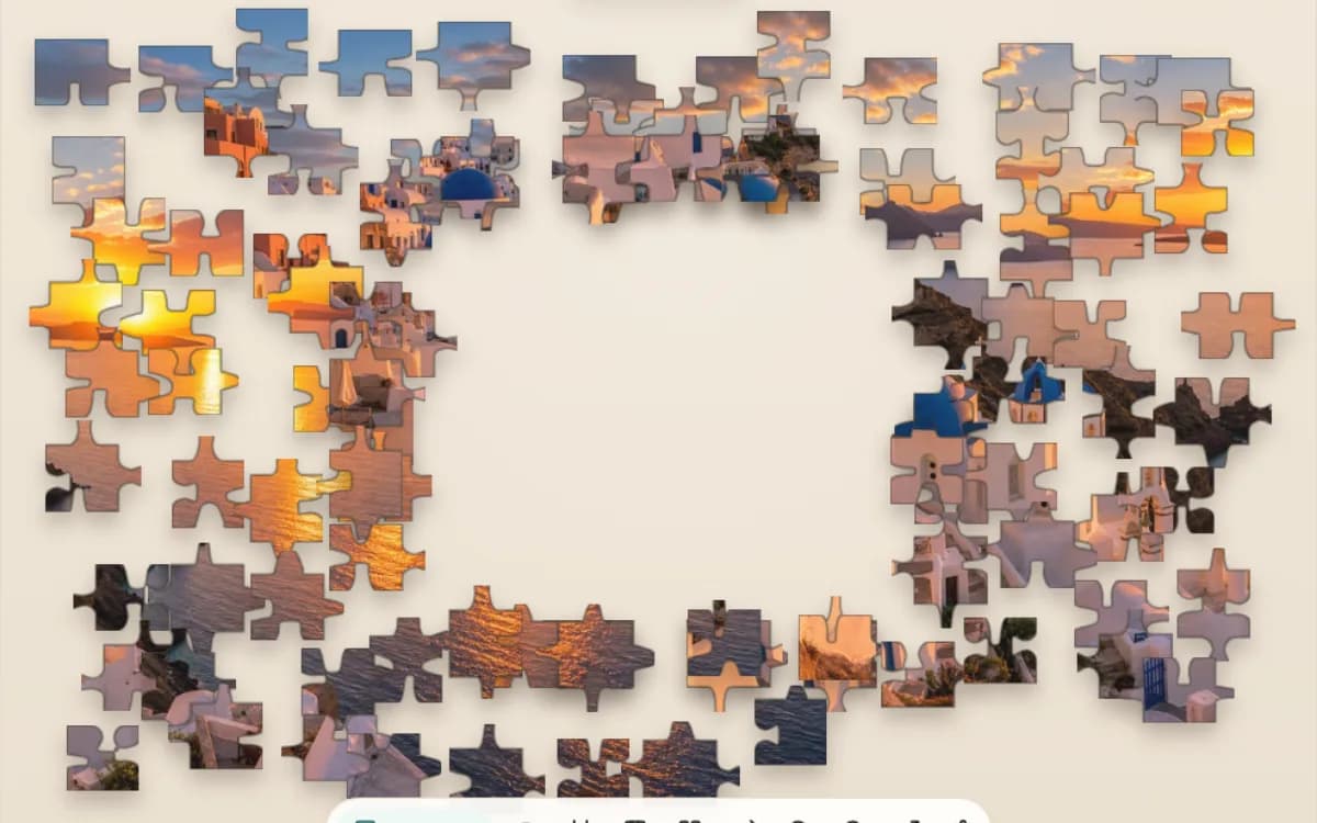 The Santorini Sunset puzzle at 300 pieces on Jigsaway, white houses and blue domes over the sea broken into pieces around the board.