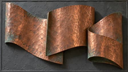 Hammered Copper Curves on Charcoal Plaster