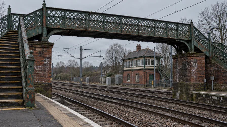 Lattice Iron Footbridge over Railroad Tracks jigsaw puzzle